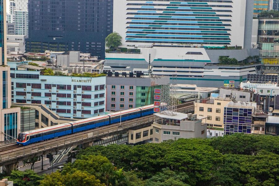 BTS Skytrain running through Bangkok with urban skyline
