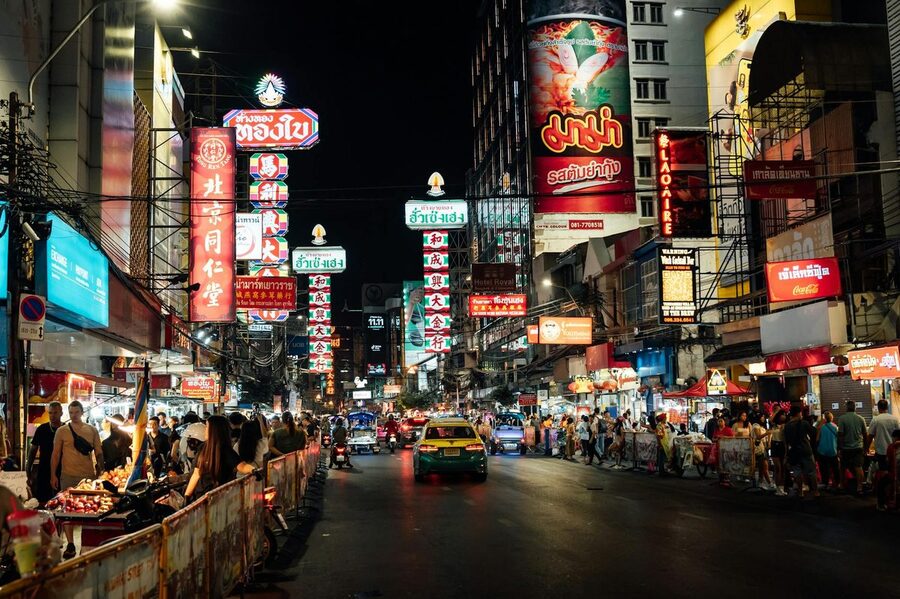 Yaowarat Road in Bangkok Chinatown lit up with neon signs at night