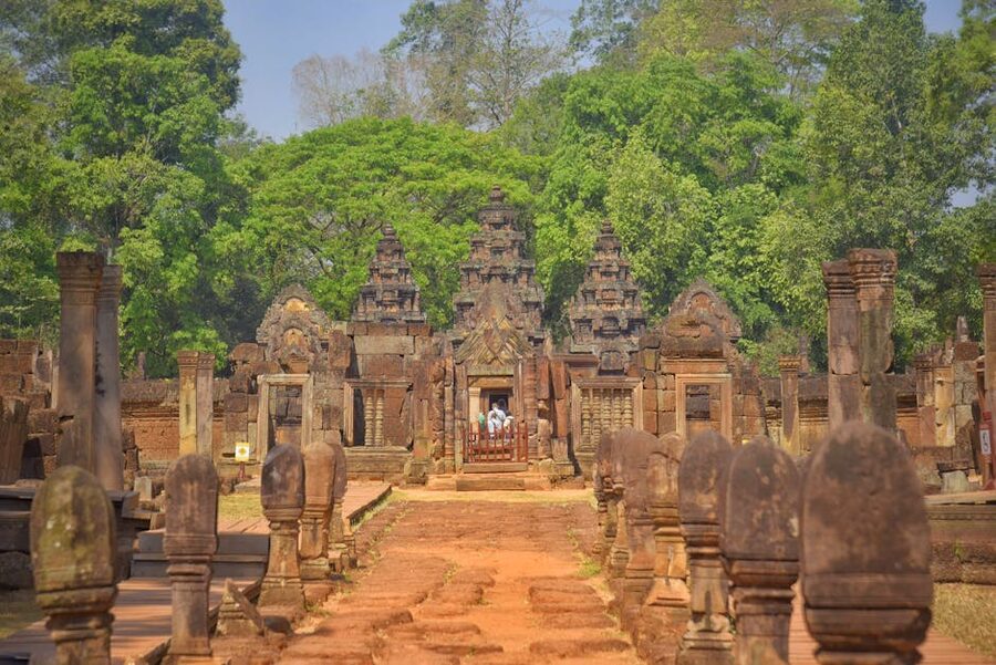 Banteay Srei temple exterior with dense greenery