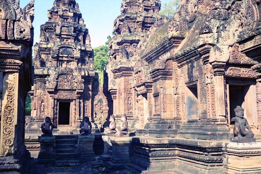 Detailed stone carvings on Banteay Srei temple walls