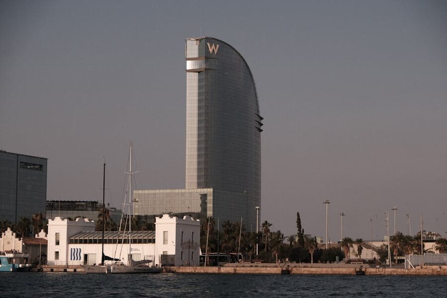Sailboats near W Hotel Barcelona at sunset
