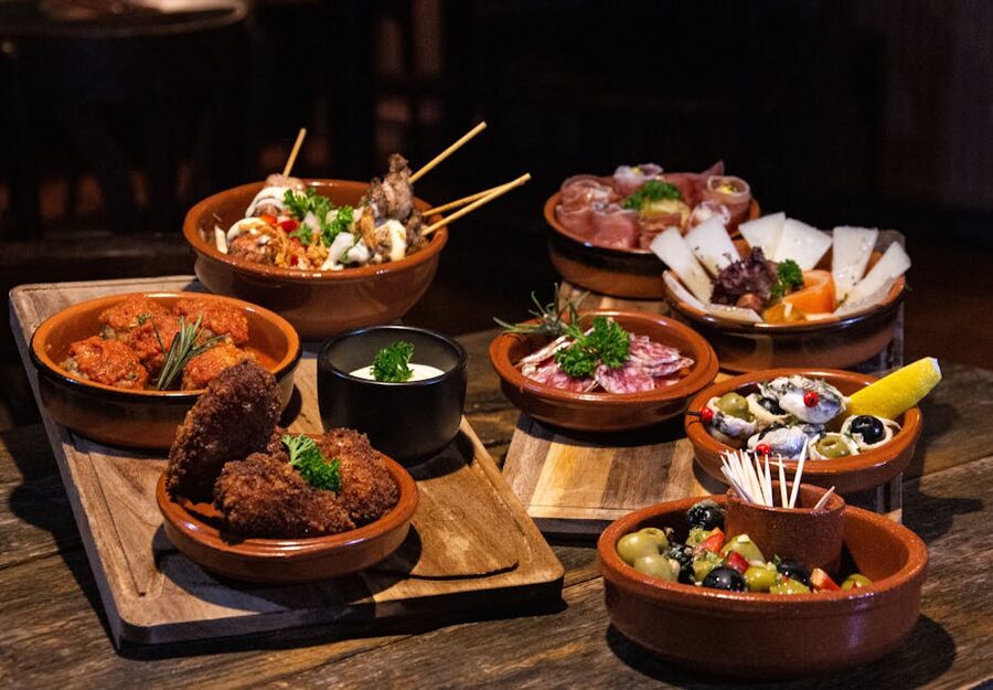Spanish tapas dishes on a wooden table