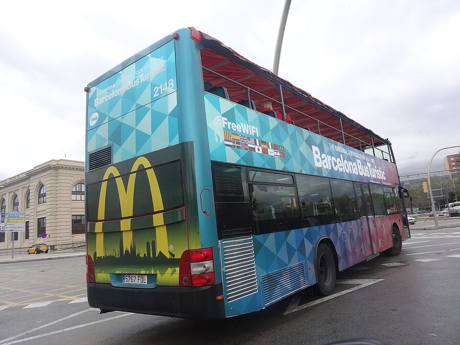 Barcelona Bus Turistic double decker bus on city street in spring