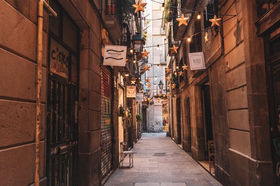 Barcelona alley with star-shaped string lights at night