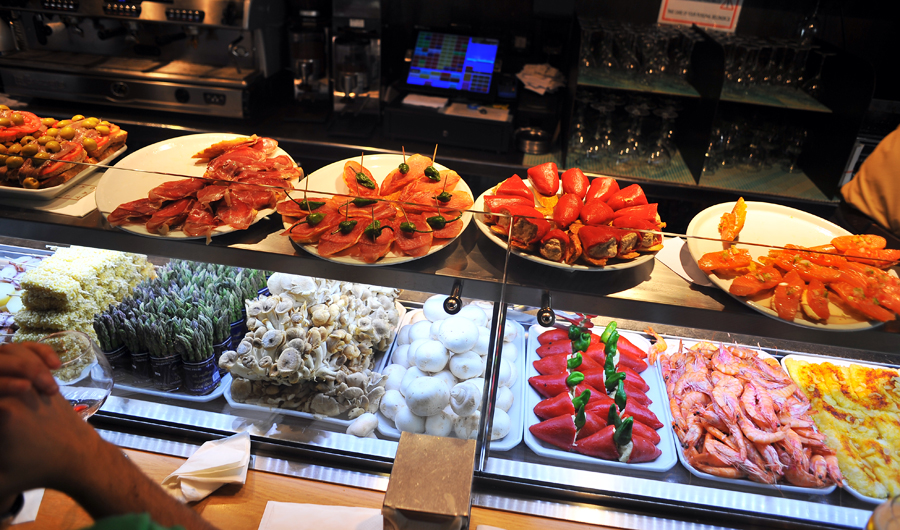 Tapas bar counter in Barcelona with food on display