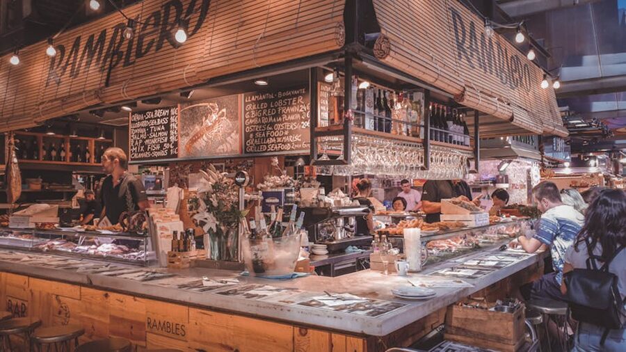 Barcelona market food stall with diners eating