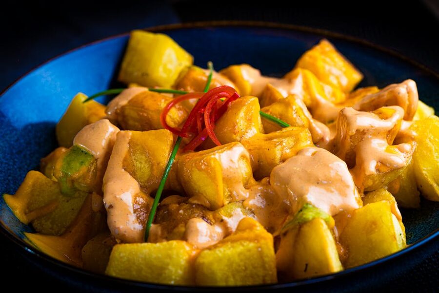 Patatas bravas with spicy aioli sauce on a Barcelona tapas tour