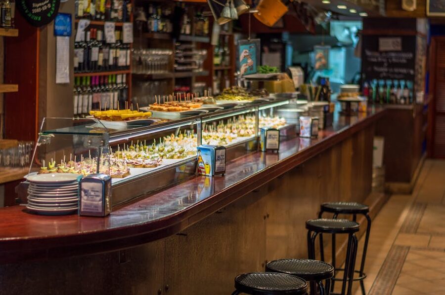 Barcelona tapas bar with pinchos lined up on the counter
