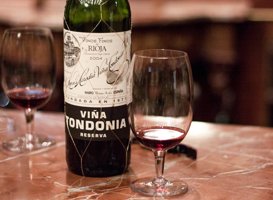 Spanish Rioja wine and glasses on a marble counter