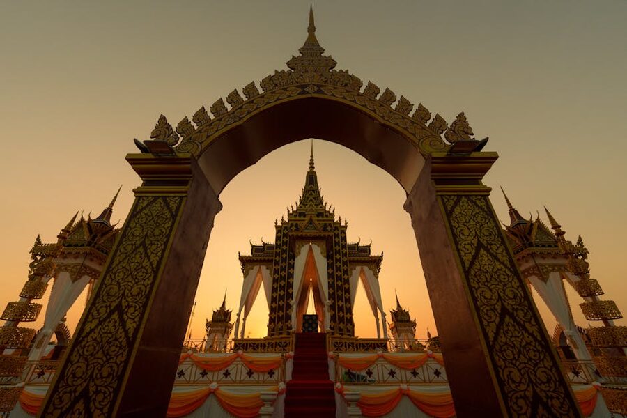 Sunrise through ornate temple archway in Battambang Cambodia