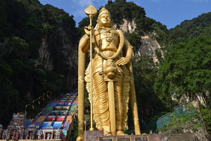 Golden Lord Murugan statue at the entrance to Batu Caves in Malaysia