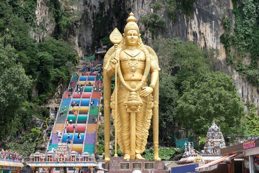 Crowds of visitors climbing the rainbow stairs at Batu Caves
