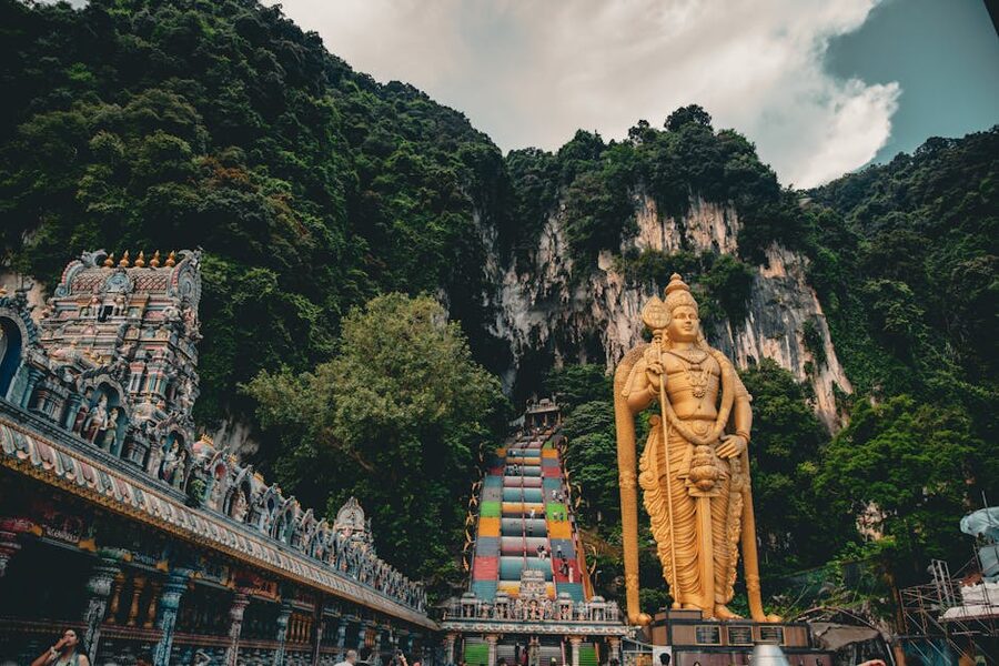 Wide view of the Lord Murugan statue and the painted staircase at Batu Caves