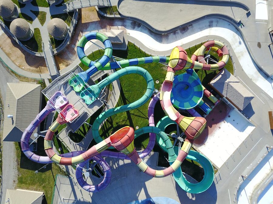Aerial view showing winding colorful water slides in a water park