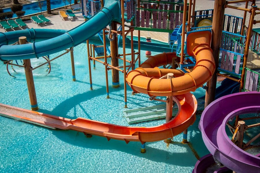 Colorful water park slides against blue sky on a sunny day