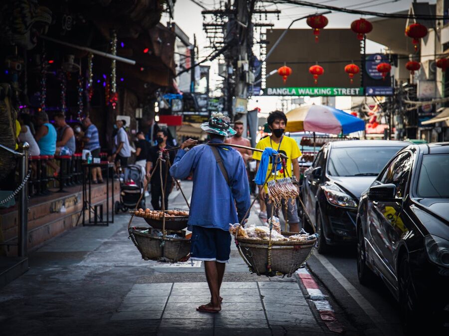 Street vendor walking on Bangla Walking Street in Phuket Thailand