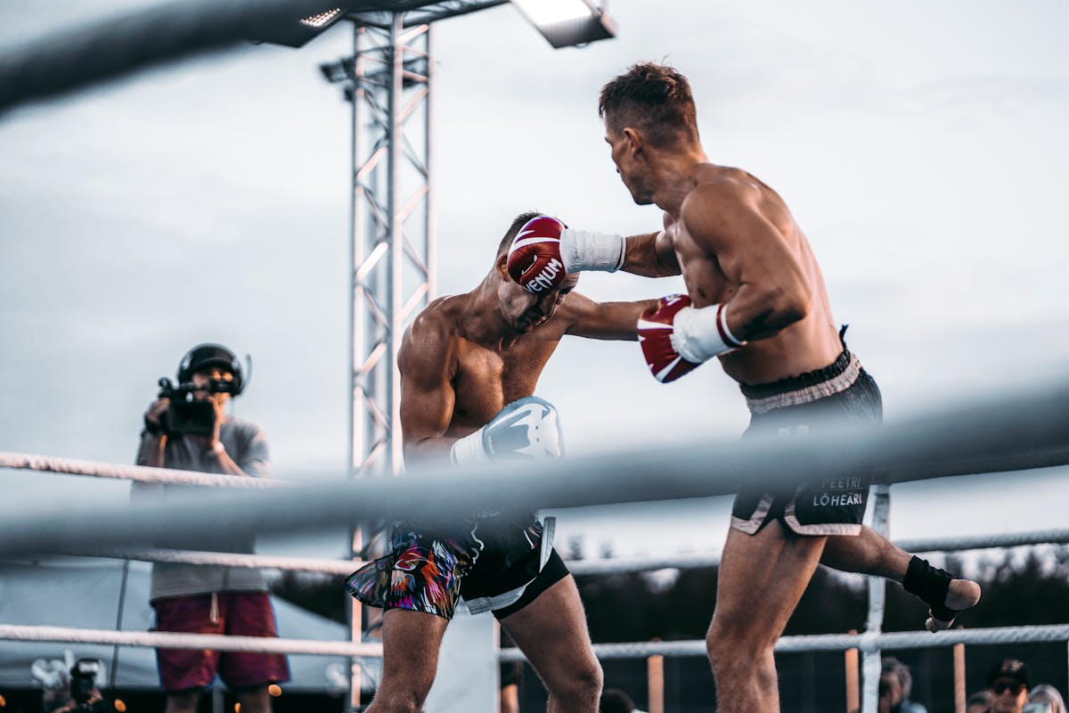 An intense boxing match capturing a powerful punch between two fighters
