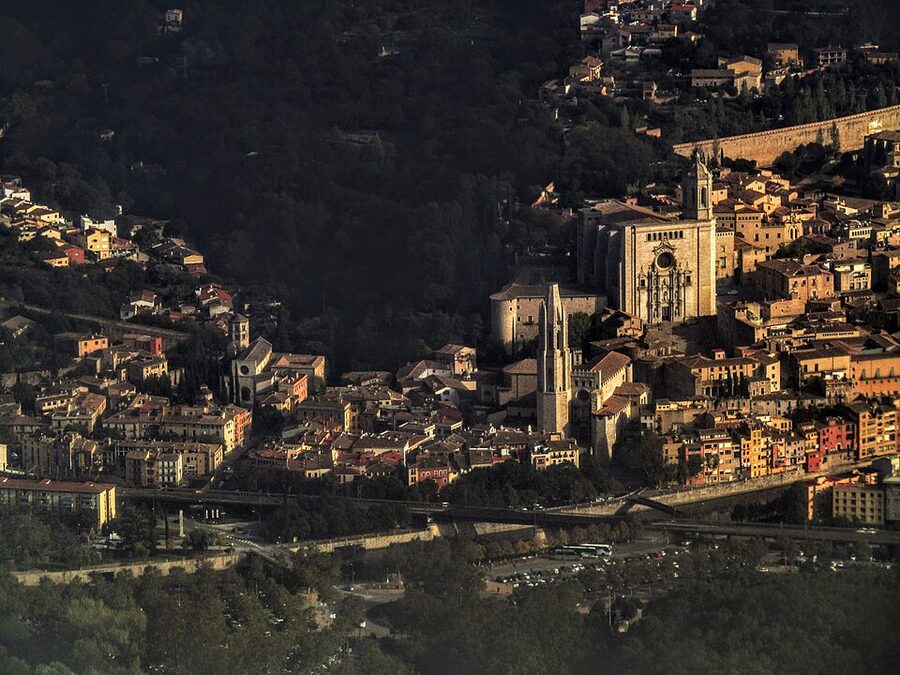Aerial view of Girona old town with cathedral and stone roofs