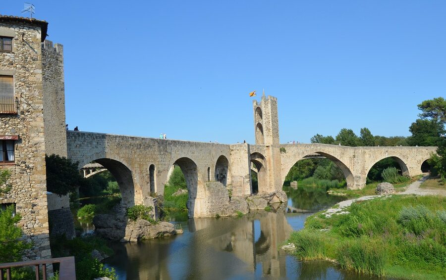 Roman bridge over a river in Girona old town