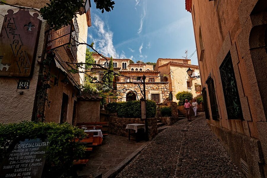Cobbled alley in Tossa de Mar's Vila Vella medieval old town