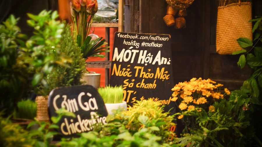 Fresh herbs and flowers at a street market in Hoi An Vietnam