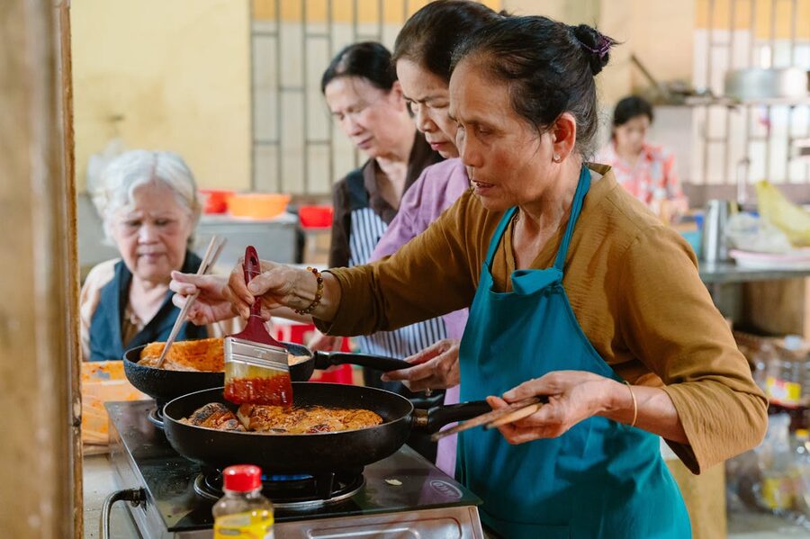 Women cooking together in a Vietnamese cooking class