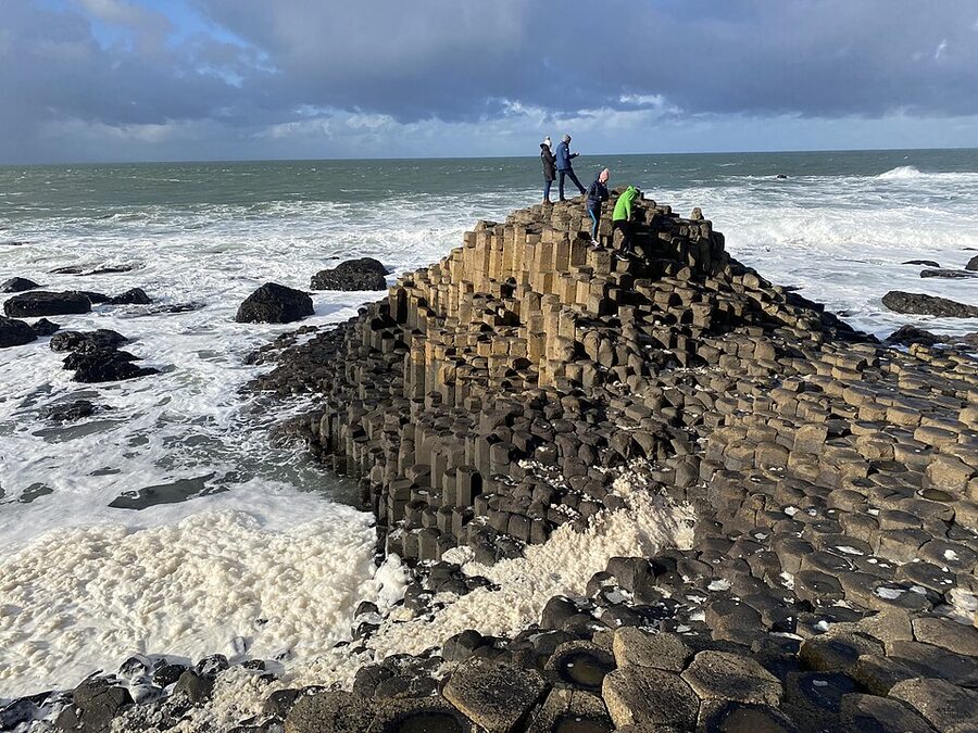 The Giants Causeway in February with sea foam from rough Atlantic conditions