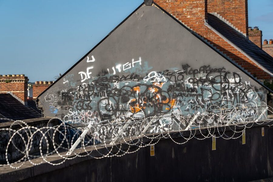 Belfast urban scene with graffiti and barbed wire