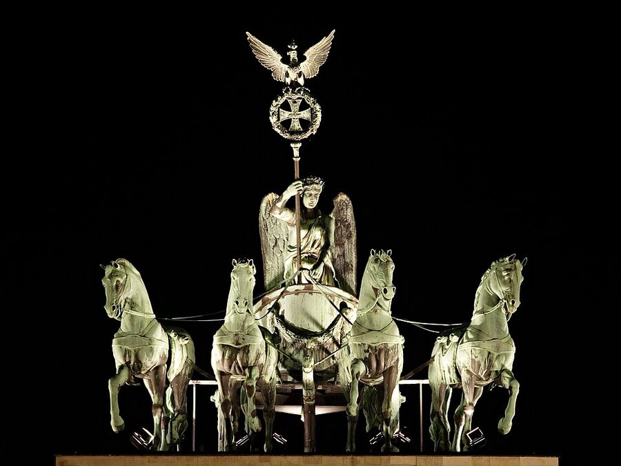 Brandenburg Gate Quadriga statue lit up at night