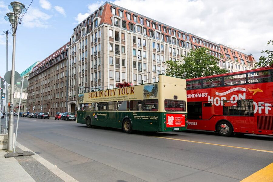 Berlin double decker hop-on hop-off tour buses on a city street