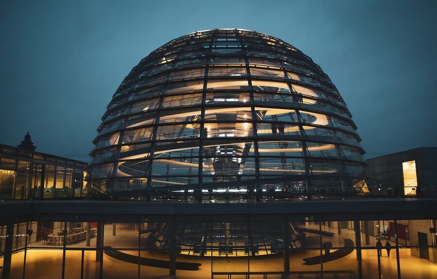 Reichstag glass dome glowing blue at night