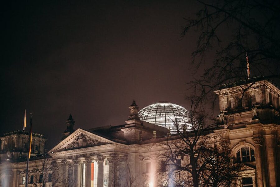 Reichstag illuminated at night with glowing glass dome