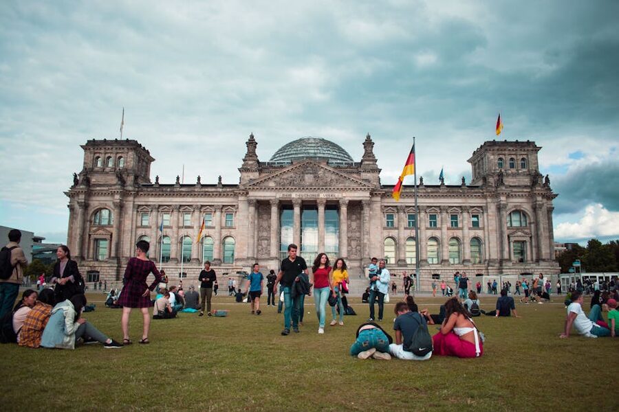 Tourists on the lawn in front of the Reichstag in summer