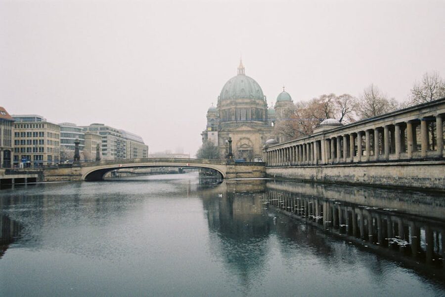 Berliner Dom and historic bridge in fog, viewed from the Spree