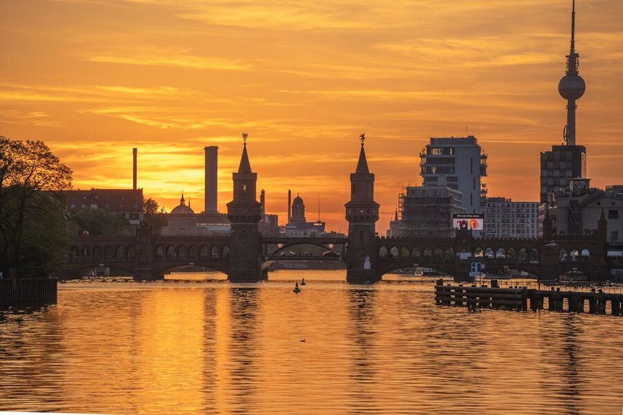 Oberbaum Bridge and TV Tower at sunset over the Spree, Berlin