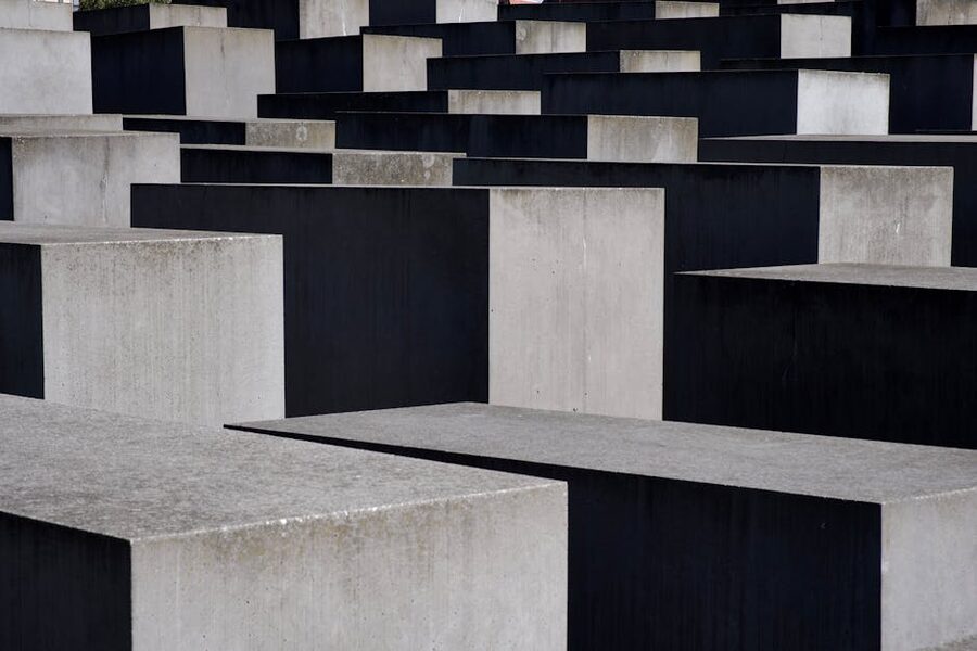 Holocaust Memorial Berlin stelae field with people walking through