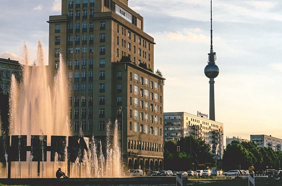 Berlin TV Tower at golden hour with modern buildings