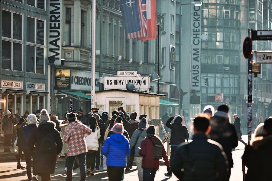 Checkpoint Charlie crowd in Berlin with reconstructed guard hut