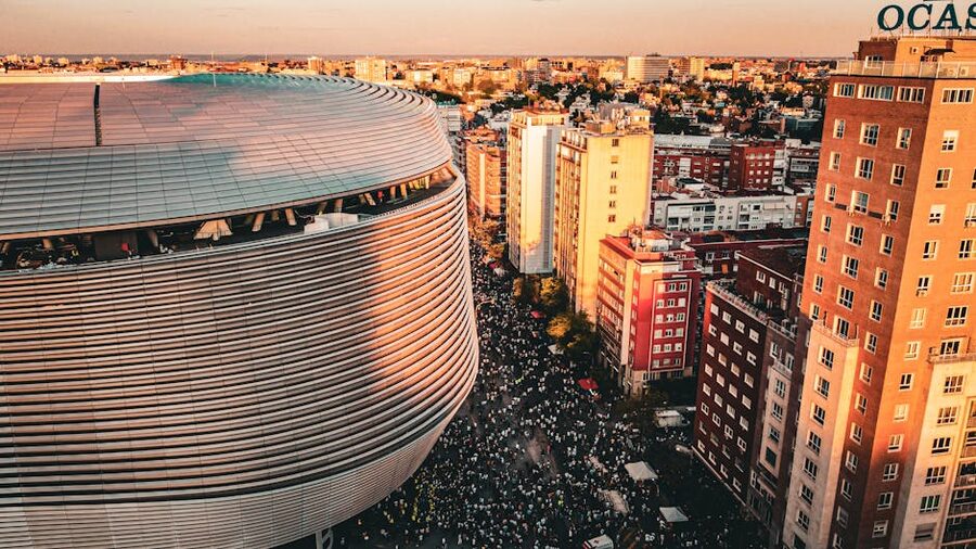 Aerial view of Bernabéu and Madrid cityscape at sunset
