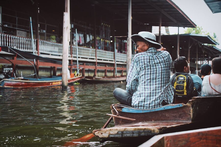 Tourists on a boat ride through the floating market canals