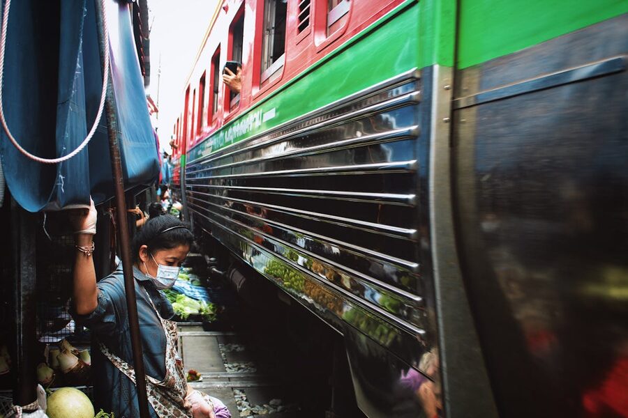 Maeklong Railway Market with the train approaching through the stalls