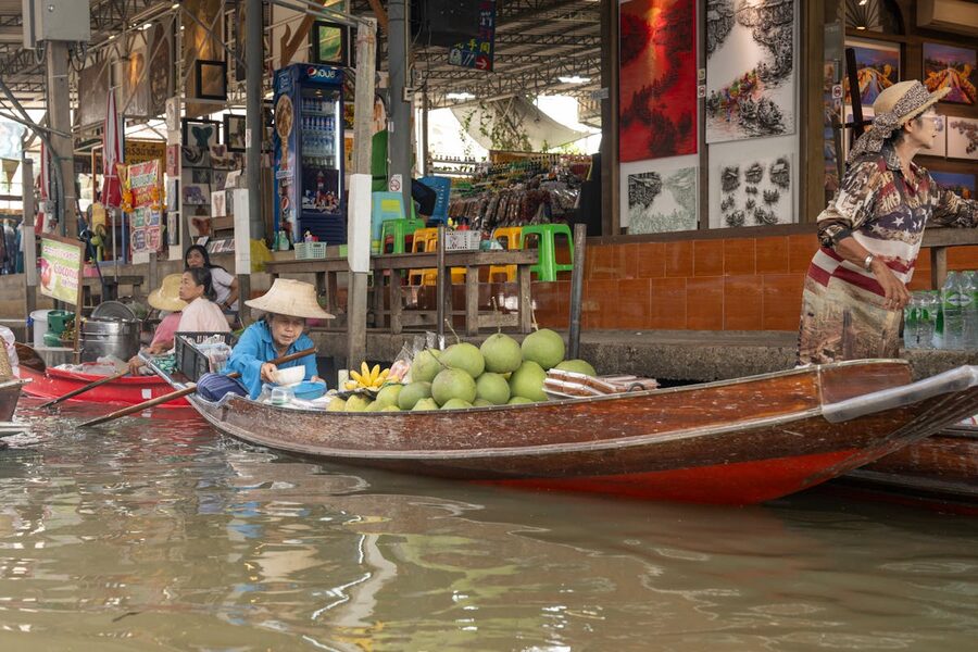 Colorful fruits displayed on vendor boats at the floating market