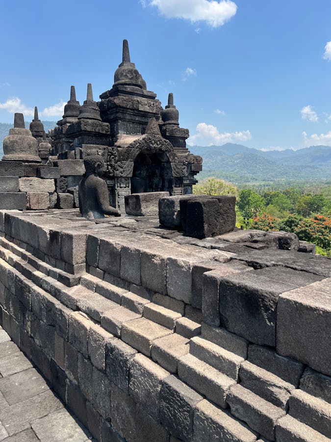 Borobudur temple with surrounding hills and rice fields