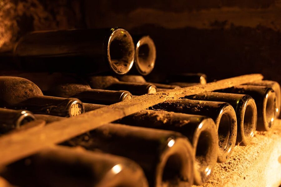 Bordeaux wine bottles aging in a cellar