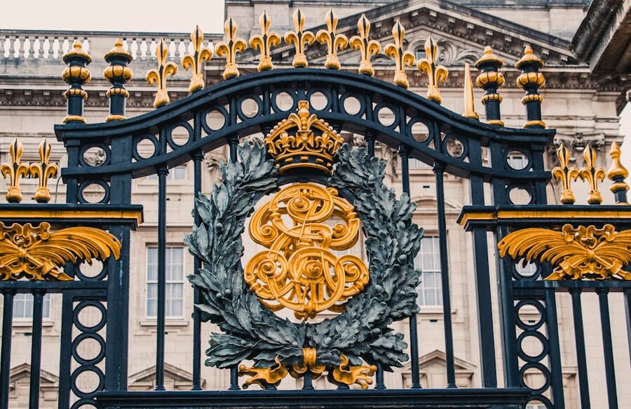 Buckingham Palace ornate gold iron gates close-up