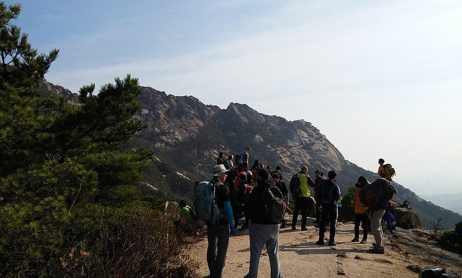 Hikers walking on a Bukhansan National Park trail