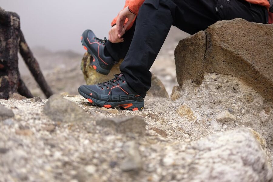 Trekking boots on a rocky trail rest