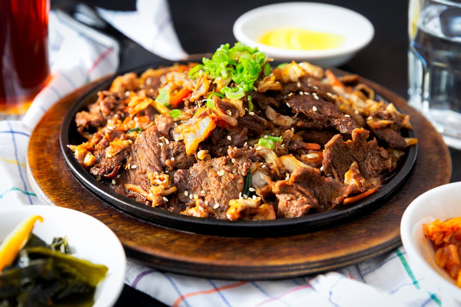 Korean bulgogi beef on hot plate with sesame