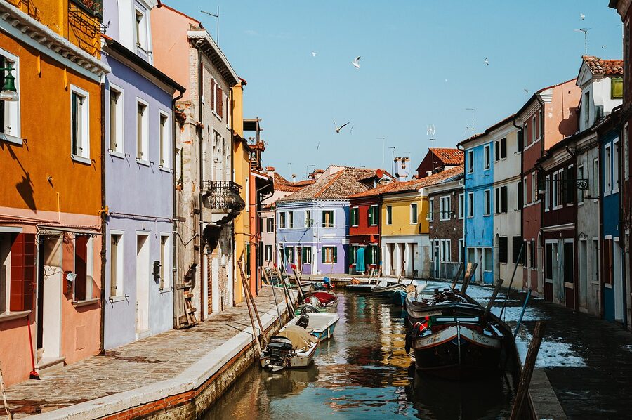 Burano canal with gondolas and rainbow-colored houses