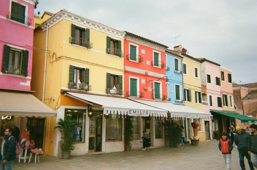 Burano street with iconic colorful houses lining a narrow lane